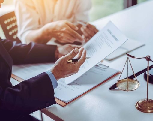 Group of middle age Asian business people and lawyers discussing and sign a contract in meeting room.