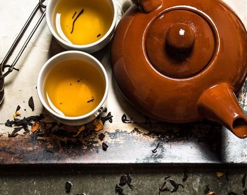 Fragrant tea brewed in a teapot. On the stone table.
