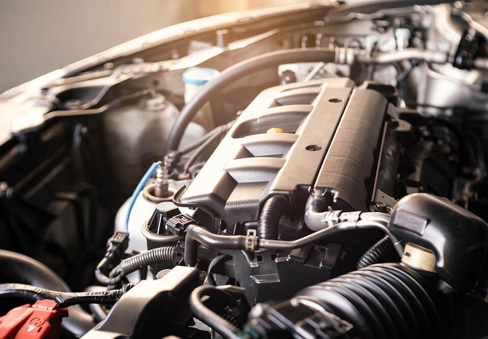 details of modern car engine with sunlight effect, shallow depth of field