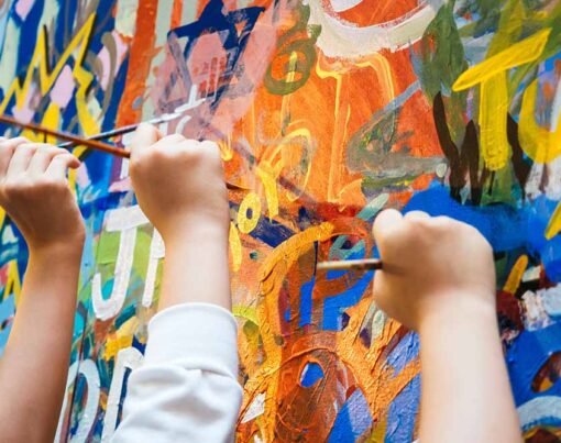 Kids hands with Colourful Paint Background