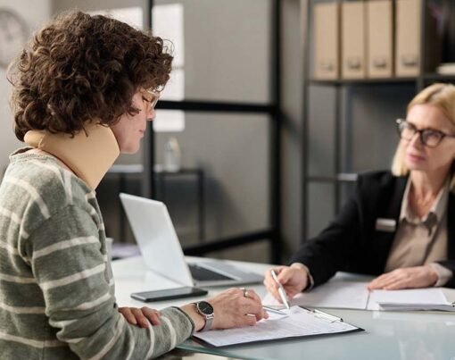 Side view portrait of young woman with neck injury filling documents at insurance agency office, copy space