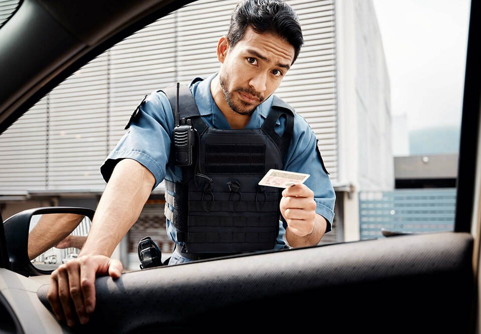 Car, drivers license or police officer in city to check info for law enforcement, protection or street safety. Cop portrait, traffic stop or security guard on patrol in a town for crime or justice